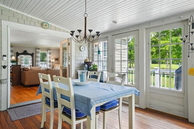 149 Acorn St, Marshfield, MA 02050 - dining space featuring light wood-style floors and a chandelier