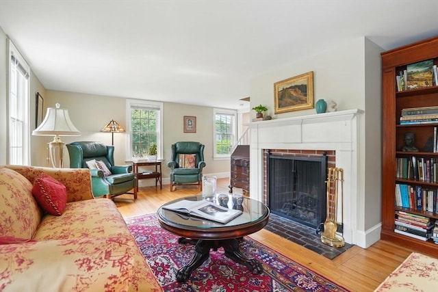 149 Acorn St, Marshfield, MA 02050 - living room with a fireplace, wood finished floors, and baseboards