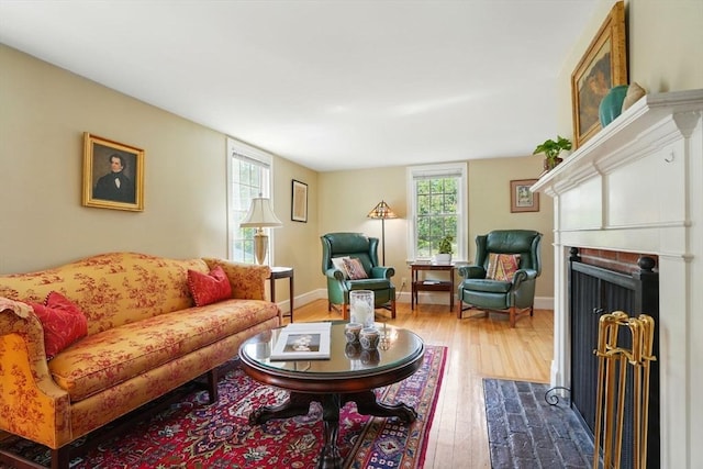 149 Acorn St, Marshfield, MA 02050 - living area featuring dark wood-type flooring, a brick fireplace, and baseboards
