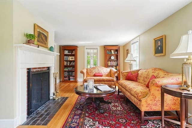 149 Acorn St, Marshfield, MA 02050 - living room featuring wood finished floors, a fireplace, plenty of natural light, and built in features