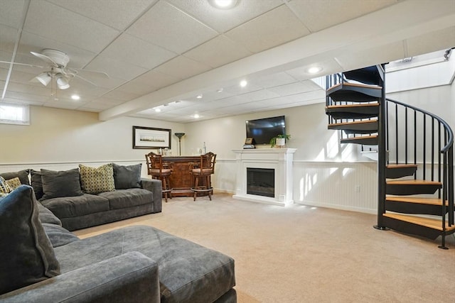 149 Acorn St, Marshfield, MA 02050 - carpeted living room featuring stairway, ceiling fan, recessed lighting, a drop ceiling, and a fireplace with raised hearth