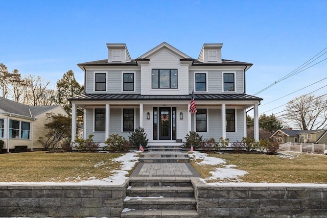 view of front facade featuring a porch and a front yard