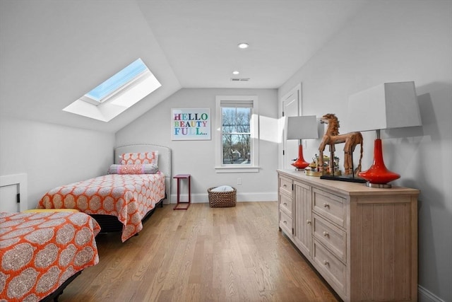 bedroom featuring lofted ceiling and light hardwood / wood-style flooring