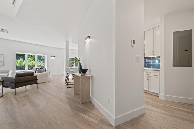 44 Ober Rd Unit 44, Newton, MA 02459 - corridor featuring electric panel, light wood-style flooring, and baseboards