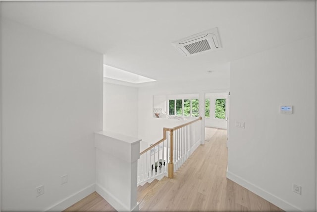 44 Ober Rd Unit 44, Newton, MA 02459 - hall with an upstairs landing, baseboards, and light wood finished floors
