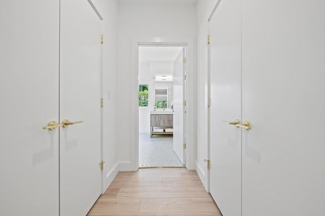 44 Ober Rd Unit 44, Newton, MA 02459 - corridor featuring light wood-style flooring and baseboards