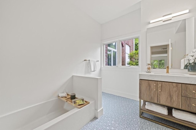 44 Ober Rd Unit 44, Newton, MA 02459 - full bathroom featuring vanity, a bath, lofted ceiling, and tile patterned flooring