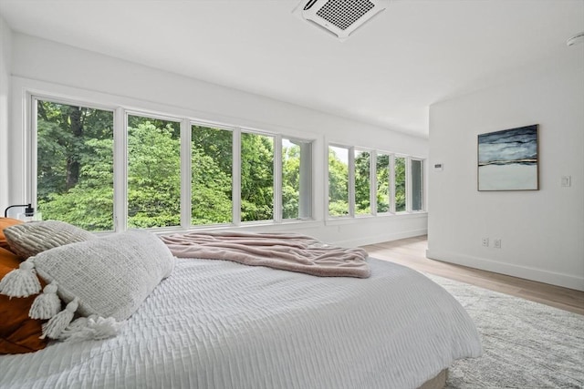 44 Ober Rd Unit 44, Newton, MA 02459 - bedroom with baseboards and light wood-style floors