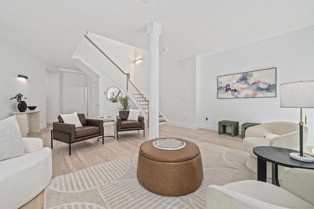 44 Ober Rd Unit 44, Newton, MA 02459 - living area featuring stairs, light wood-type flooring, and baseboards