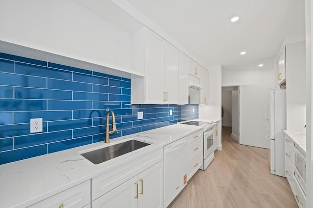 44 Ober Rd Unit 44, Newton, MA 02459 - kitchen with white appliances, a sink, white cabinetry, light wood finished floors, and recessed lighting