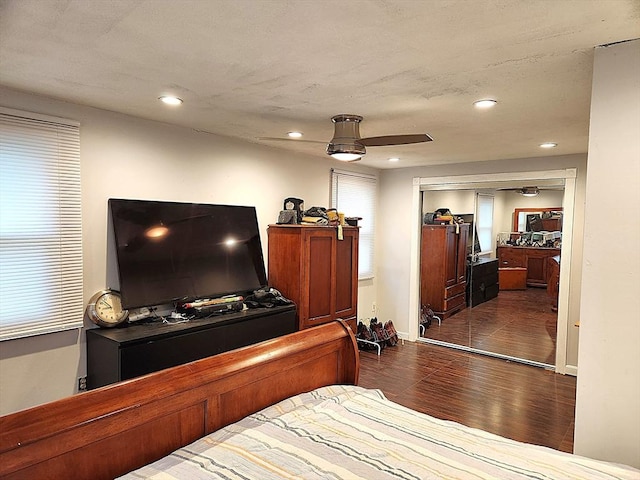 bedroom featuring ceiling fan, recessed lighting, baseboards, and dark wood finished floors