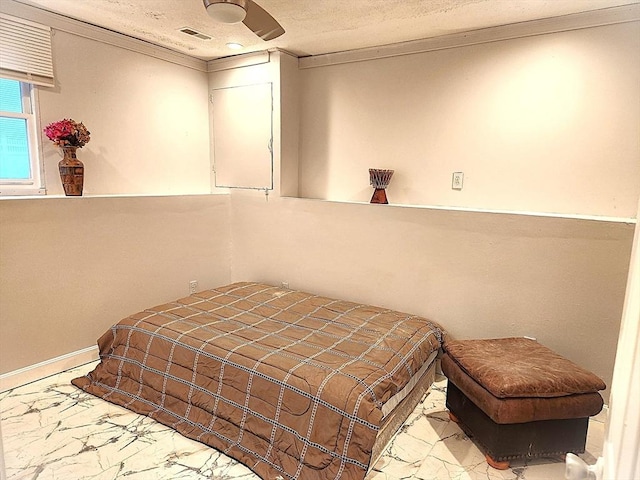 bedroom with marble finish floor, ornamental molding, and visible vents