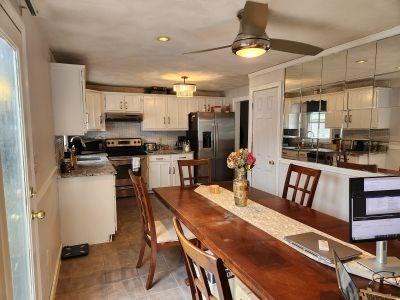 dining room with plenty of natural light, ceiling fan, and recessed lighting