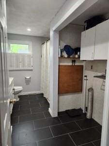 bathroom with toilet, a shower with shower curtain, tile patterned floors, and recessed lighting