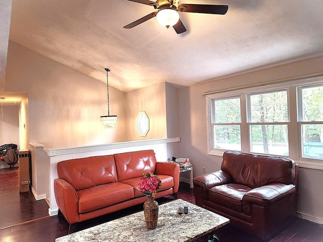 living area with a wealth of natural light, lofted ceiling, and ceiling fan