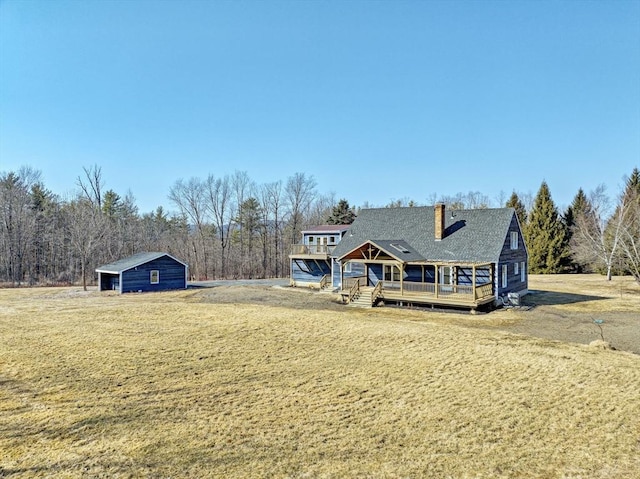 view of front of house featuring a wooden deck and a chimney