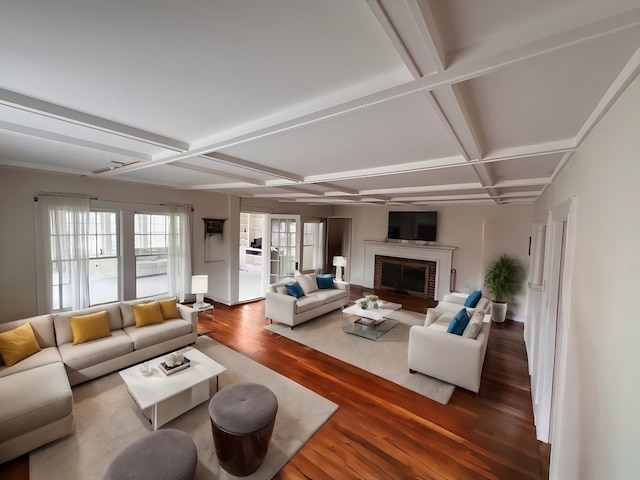 living room featuring beam ceiling, a fireplace, wood-type flooring, and coffered ceiling