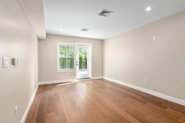 425 Lagrange St Unit 107, Boston, MA 02132 - spare room featuring wood finished floors, baseboards, and recessed lighting