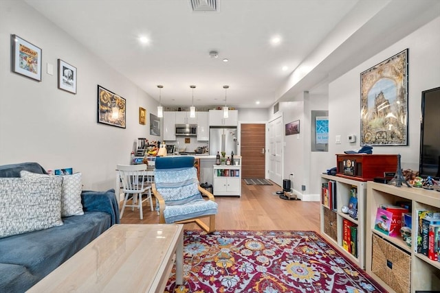 425 Lagrange St Unit 107, Boston, MA 02132 - living area with light wood-style flooring and recessed lighting