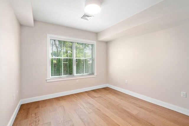 425 Lagrange St Unit 107, Boston, MA 02132 - spare room with light wood-style flooring and baseboards