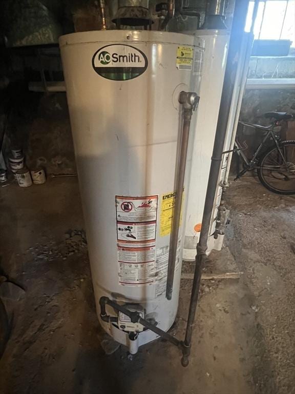 utility room featuring water heater