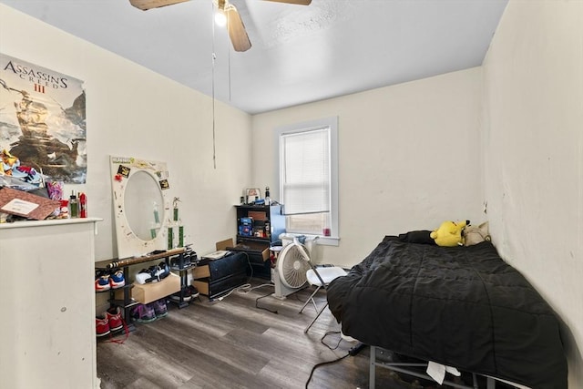 bedroom featuring hardwood / wood-style flooring and ceiling fan