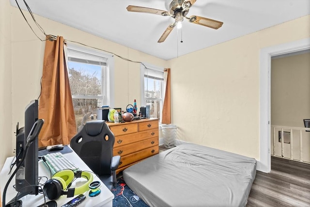 bedroom with dark wood-type flooring and ceiling fan