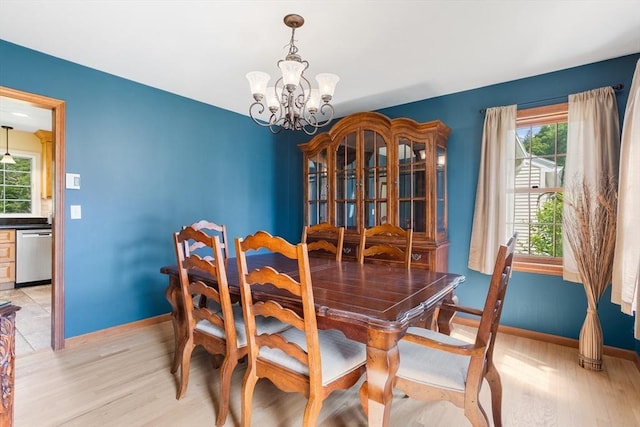 8 Macleod Ln, Acton, MA 01720 - dining room featuring light wood-type flooring, a chandelier, and plenty of natural light