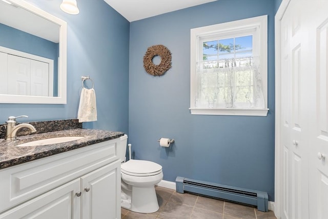 8 Macleod Ln, Acton, MA 01720 - bathroom with a baseboard radiator, vanity, toilet, tile patterned floors, and baseboards