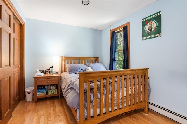 8 Macleod Ln, Acton, MA 01720 - bedroom featuring a baseboard heating unit and light wood-style floors