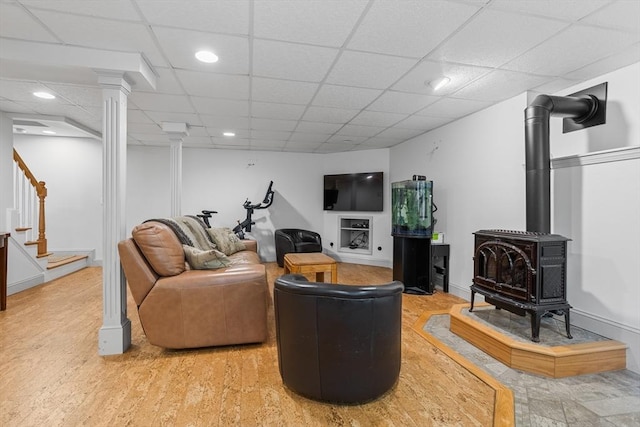 8 Macleod Ln, Acton, MA 01720 - living area featuring stairs, a paneled ceiling, a wood stove, and recessed lighting