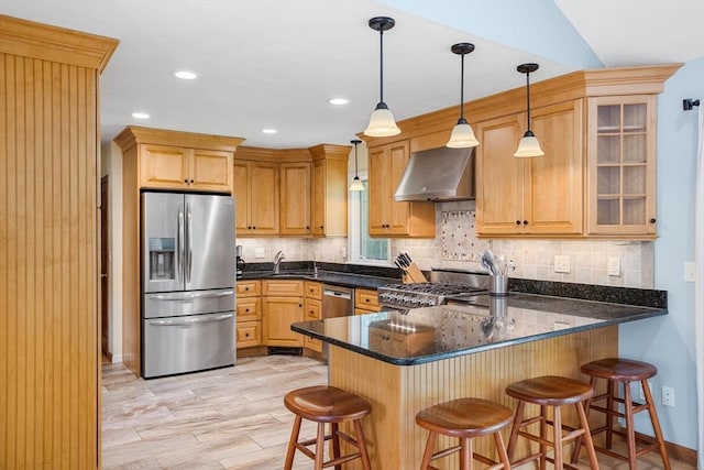 8 Macleod Ln, Acton, MA 01720 - kitchen featuring stainless steel appliances, range hood, a peninsula, backsplash, and a sink