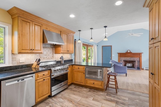 8 Macleod Ln, Acton, MA 01720 - kitchen with stainless steel appliances, range hood, a peninsula, lofted ceiling, and a fireplace