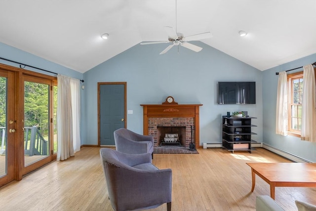 8 Macleod Ln, Acton, MA 01720 - living room featuring a fireplace, lofted ceiling, a baseboard heating unit, ceiling fan, and light wood-style flooring