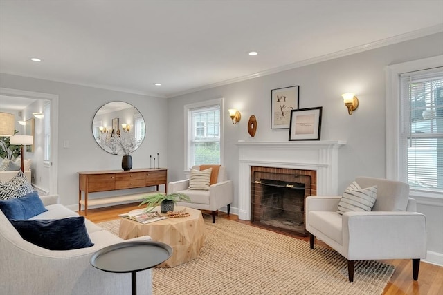 100 Summit, Brookline, MA 02446 - living room with healthy amount of natural light, crown molding, a fireplace, light wood-style flooring, and recessed lighting
