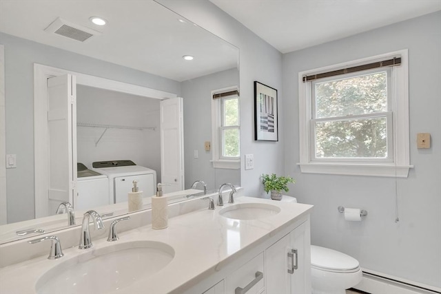 100 Summit, Brookline, MA 02446 - bathroom featuring a baseboard radiator, washing machine and dryer, double vanity, toilet, and recessed lighting