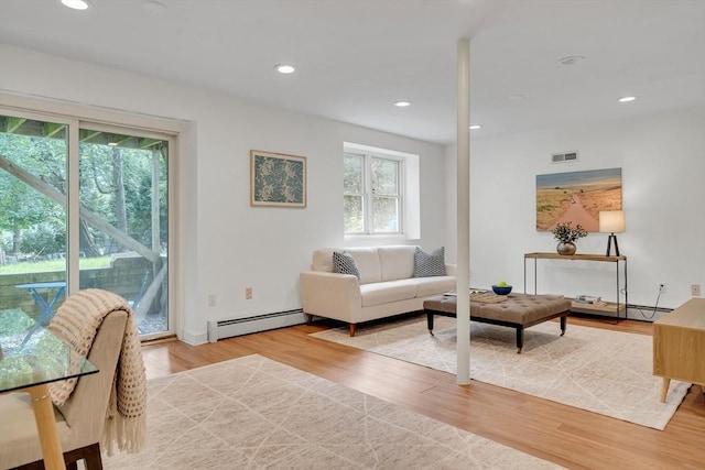 100 Summit, Brookline, MA 02446 - living area with a baseboard heating unit, wood finished floors, recessed lighting, and baseboards