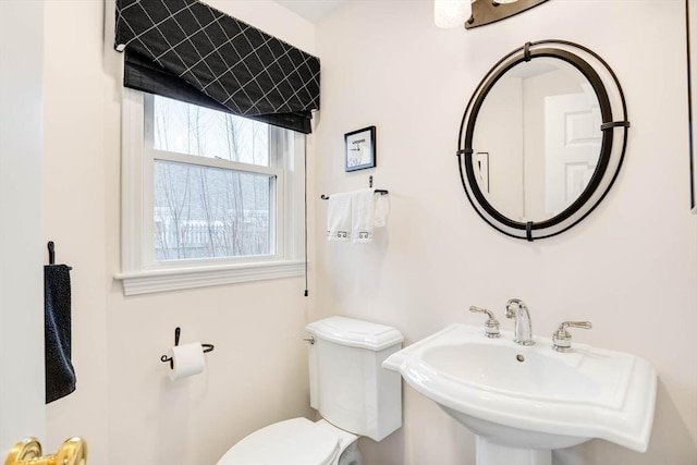 bathroom with toilet and sink