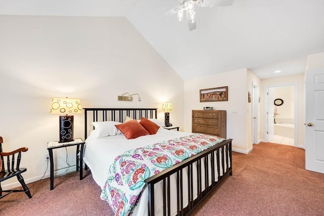 carpeted bedroom with connected bathroom and vaulted ceiling