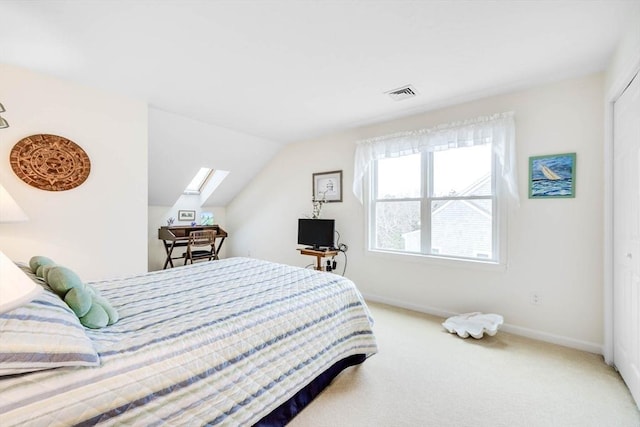 carpeted bedroom with a closet and lofted ceiling