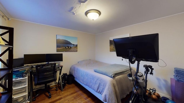 bedroom with wood finished floors