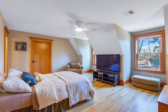 bedroom with ceiling fan and light wood-type flooring