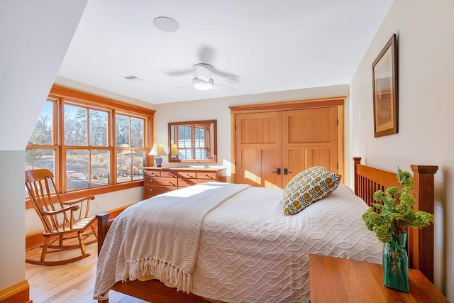 bedroom featuring ceiling fan and light hardwood / wood-style flooring