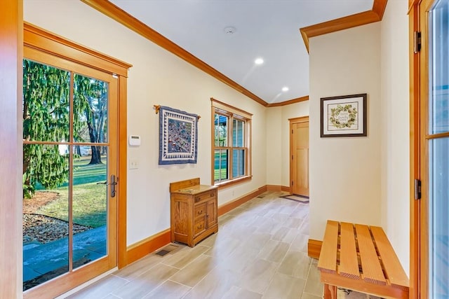 entryway featuring crown molding