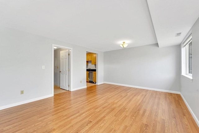 360 Littleton Rd Unit A5, Chelmsford, MA 01824 - spare room featuring light wood-style flooring and baseboards