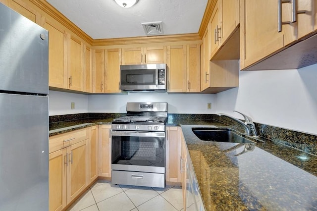 360 Littleton Rd Unit A5, Chelmsford, MA 01824 - kitchen with appliances with stainless steel finishes, a sink, light tile patterned floors, light brown cabinetry, and dark stone countertops