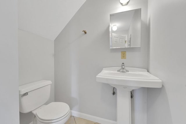 360 Littleton Rd Unit A5, Chelmsford, MA 01824 - bathroom with toilet, tile patterned floors, and baseboards