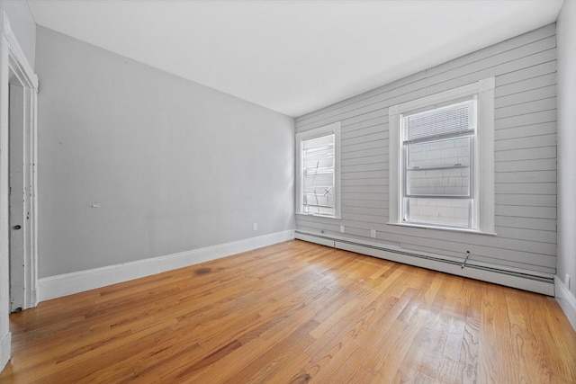 633 E Sixth St, Boston, MA 02127 - empty room with light wood-style floors, baseboards, and a baseboard radiator
