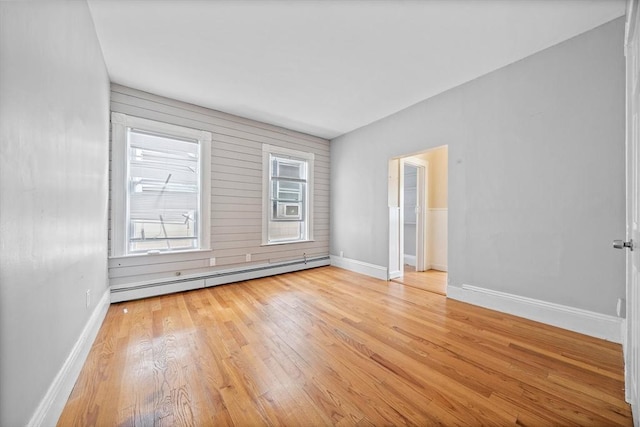 633 E Sixth St, Boston, MA 02127 - empty room with baseboard heating, wood finished floors, plenty of natural light, and baseboards