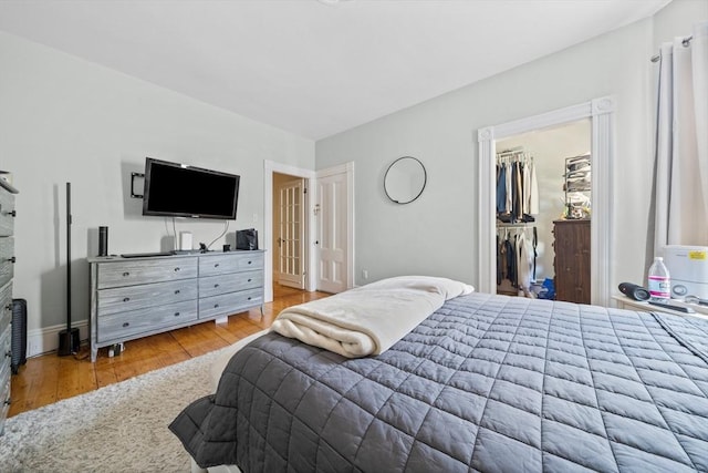 633 E Sixth St, Boston, MA 02127 - bedroom featuring wood finished floors, a spacious closet, and baseboards